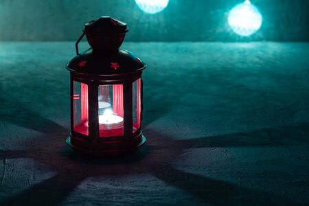 Red christmas lantern on grey surface soft focusの写真素材