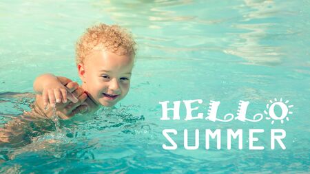 3 year old boy swimming in crystal clear water.の写真素材