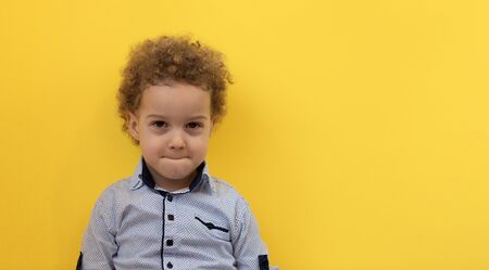 Portrait of boy with raised hands up