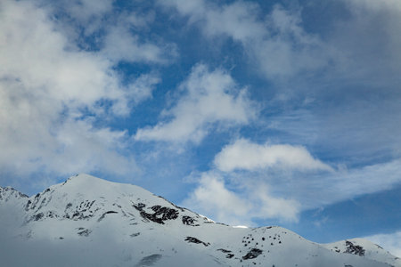Top of snow capped mountains during the winter time