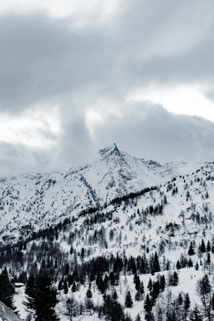 Top of snow capped mountains during the winter timeの写真素材