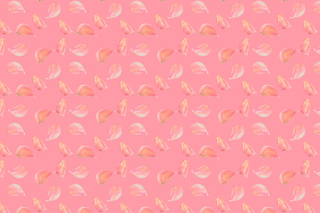 garlic cloves pattern on pastel pink color background. Minimal flat lay food texture