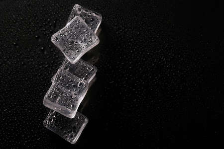 Abstract creative background with ice cubes and water drops.