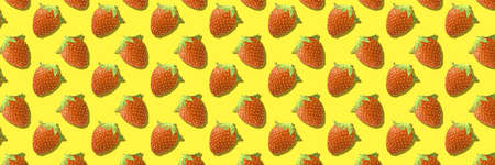Whole strawberries fruit pattern on yellow color backgroundの写真素材