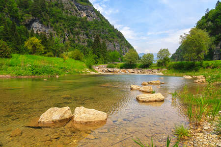 Stream with its refreshing water between the mountain peaks