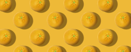 Whole fresh orange fruit pattern color backgroundの写真素材