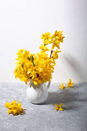 Pattern with fresh yellow flowers on pastel backround.
