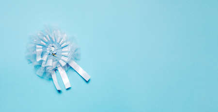 Award ribbon for baby shower party on blu light background