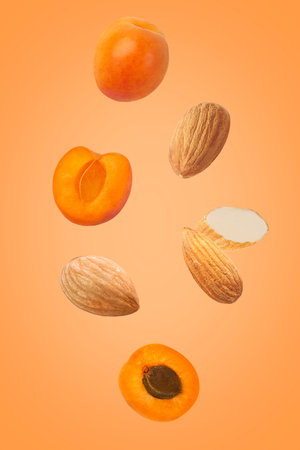 Seven fruits isolated on orange background with clipping pathの写真素材