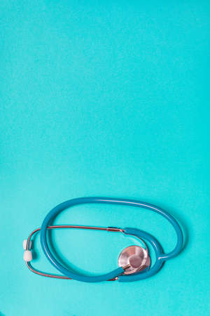 Stethoscope on pastel blue background from aboveの写真素材