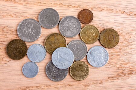 old european coins on wooden backgroundの写真素材