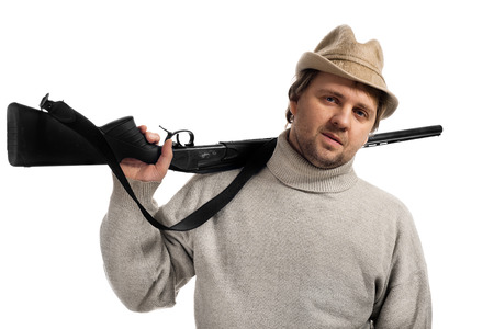 a hunter with a gun