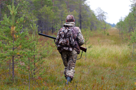 hunter waiting for prey on the swamp
