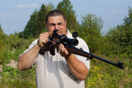 hunter charges rifle on the hunting