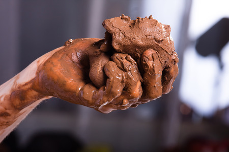 raw clay in the hands of womenの写真素材