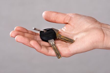 closeup of woman hand holding keys of apartment
