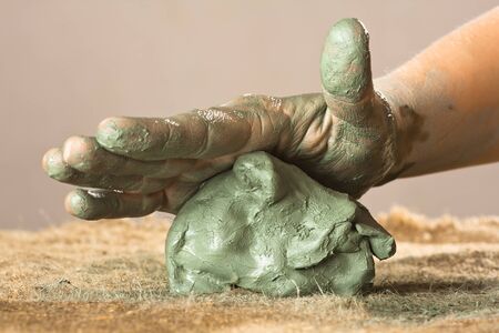 hands of women working with blue clay, closeupの写真素材