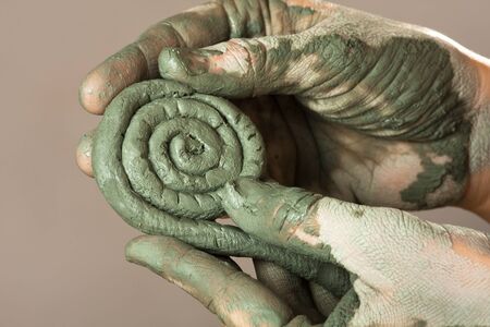 hands of women working with blue clay, closeupの写真素材