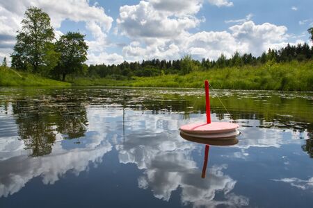 loaded fishing trap (circle) is on the lake waiting for the bite of predatory fish
の写真素材