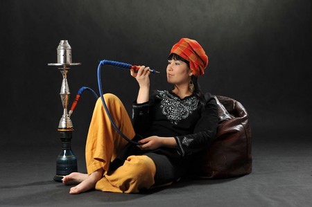 asian woman with hookah.の写真素材