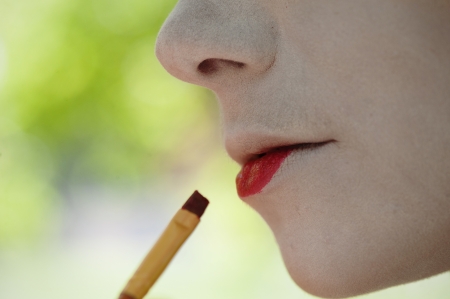 Painting geisha style makeupの写真素材