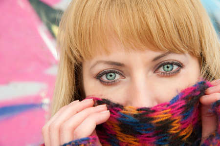 Young woman in multicoloured scarf  closeup 