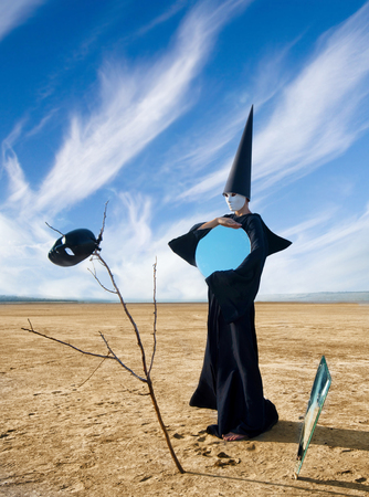 Strange person in black cloak with the mirror  Artworkの写真素材