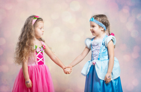 First friend  Portrait of two little girls holding hands, abstract の写真素材