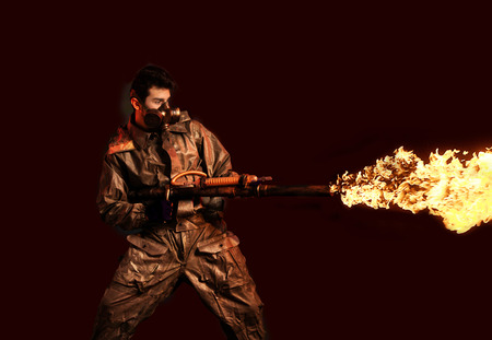 Soldier with flamethrower, dark backgroundの写真素材
