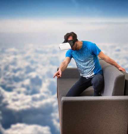 Man wearing virtual reality 3D glasses lives in a virtual world