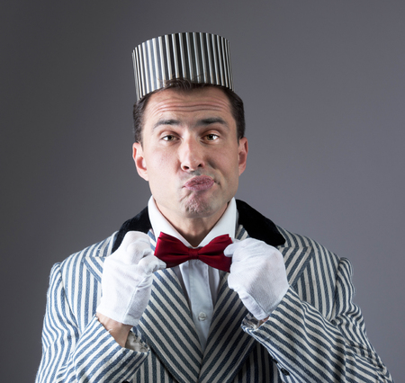 Portrait of a comedian who adjusts his tie