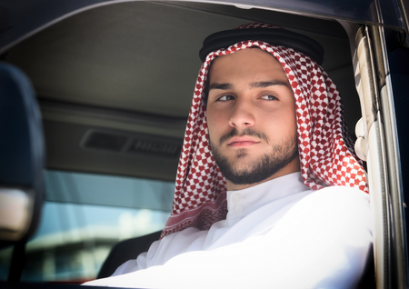 Portrait of a handsome arabian man driving a carの写真素材