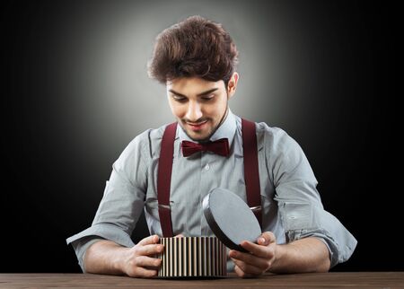 Handsome man with the gift boxの写真素材