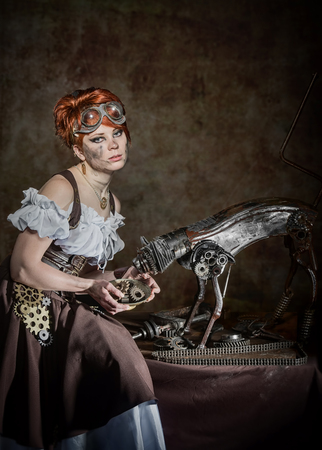 Steam-punk girl feeding her mechanical petの写真素材