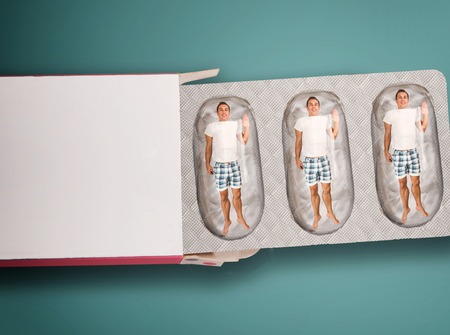 Man inside capsule. Tablet concept.の写真素材