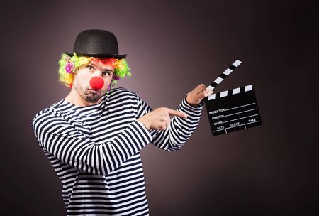 Funny clown with clipper box.