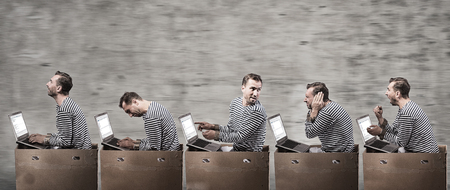 Programmers in cell boxes in the office. Office coveyer concept.の写真素材