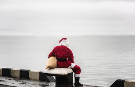 Santa claus looking look into the distance. Loneliness concept.の写真素材
