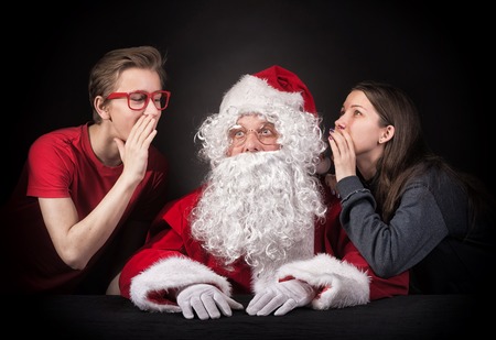 Teenagers tells Santa about their wishes for the christmas presents.の写真素材