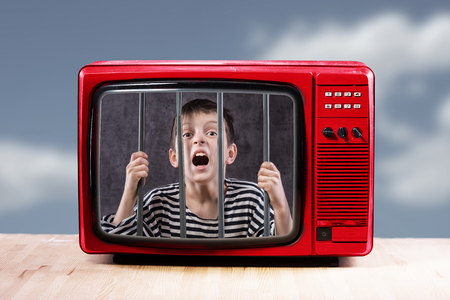 Boy in entertainment prison concept.の写真素材
