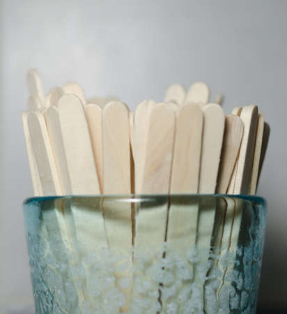 A cup filled with  sticksの写真素材