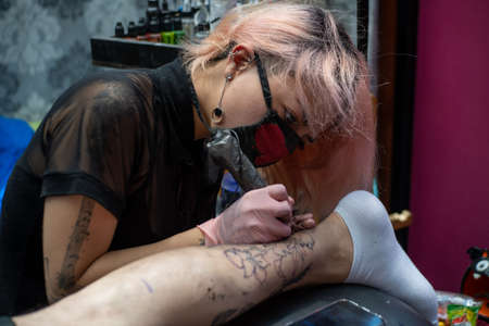 Tattooing the external line of the designの写真素材
