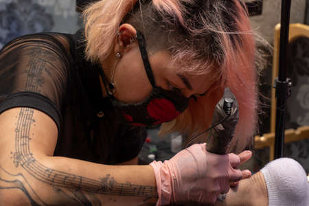 Filling the tattoo design with colorの写真素材