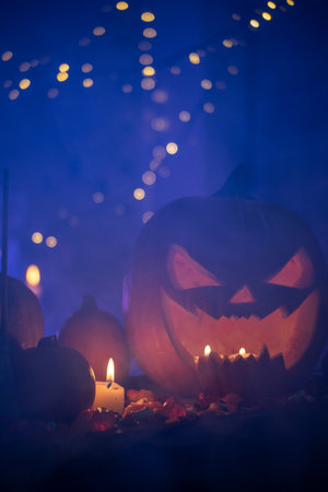 Halloween set with candy and a sculpted pumpkin headの写真素材