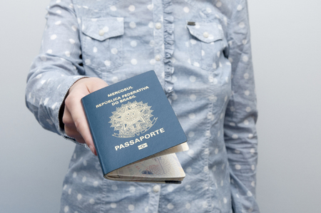A passport is a government-issued document that certifies the identity and nationality of its holder for the purpose of international travel の写真素材