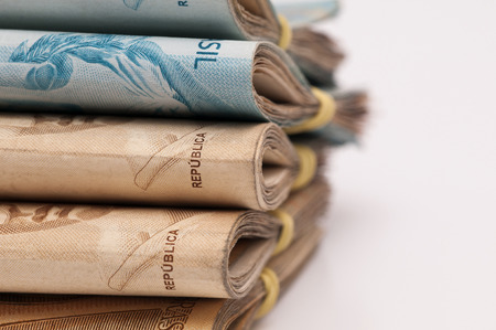 A few bills of brazilian currency  real  on white backgroundの写真素材
