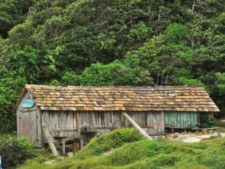 Old fhishers shed by the beachの写真素材