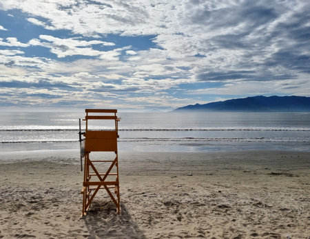 Lifeguard chair on empty beachの写真素材