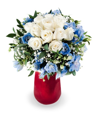 colorful floral bouquet from white roses and delphinium centerpiece in red vase isolated on white backgroundの写真素材