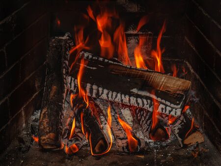 fireplace with wood and fire の写真素材